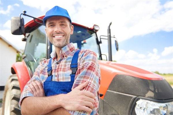 Farmer leaning on the tractor