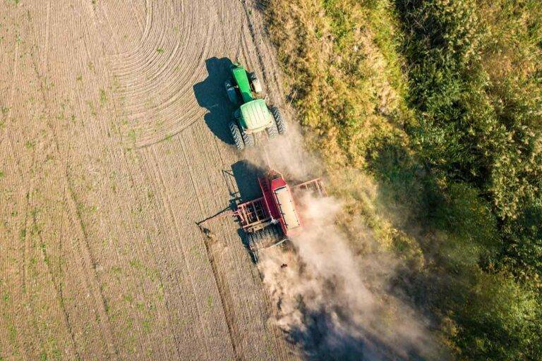 top down aerial view of green tractor cultivating 2022 01 06 04 35 46 utc