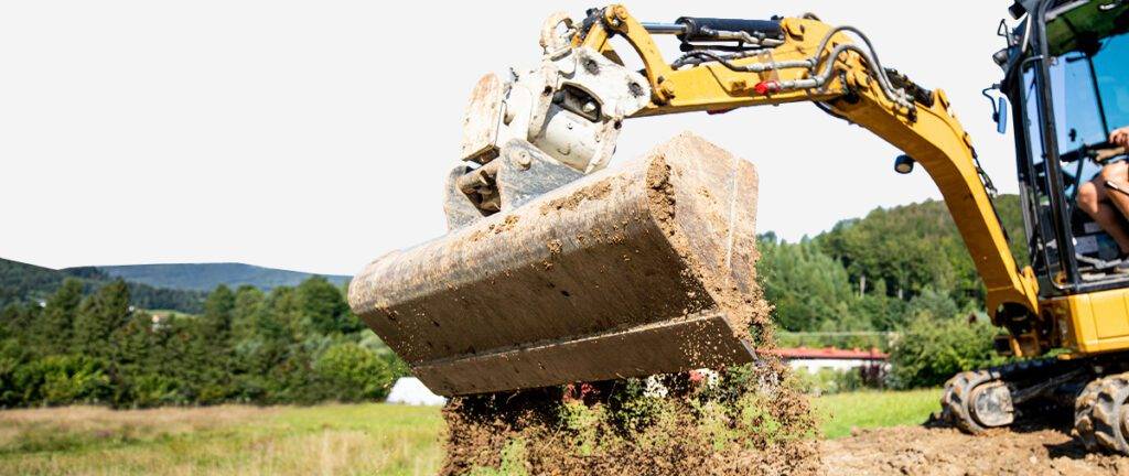 how to dig a trench with a mini excavator