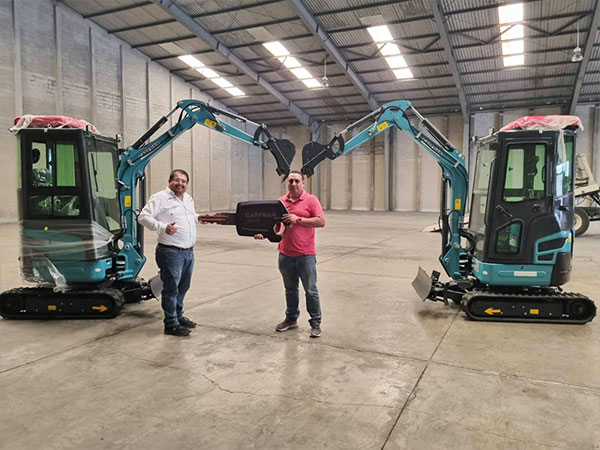Compact excavator working at a customer site