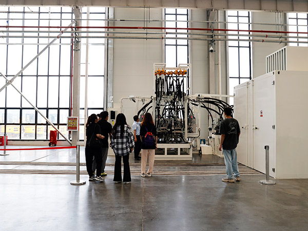 Visitors inspecting the Qilu factory