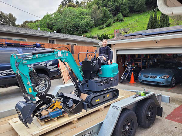 Customer reviewing compact agricultural equipment