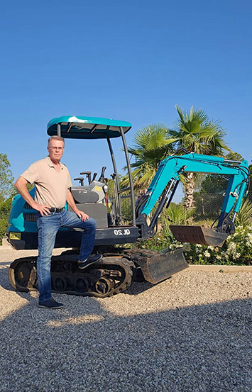 Customer with a Qilu compact excavator