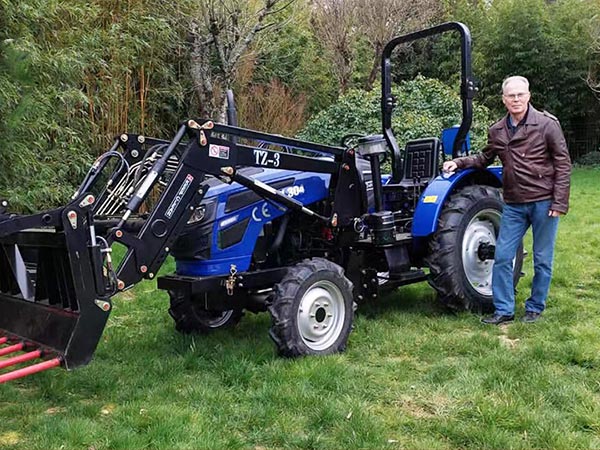 Customer with a red compact excavator