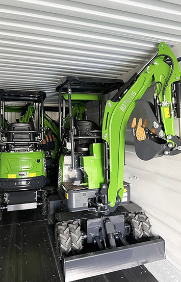 Green compact excavator secured for shipping