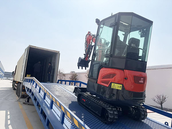 Compact excavator loading=