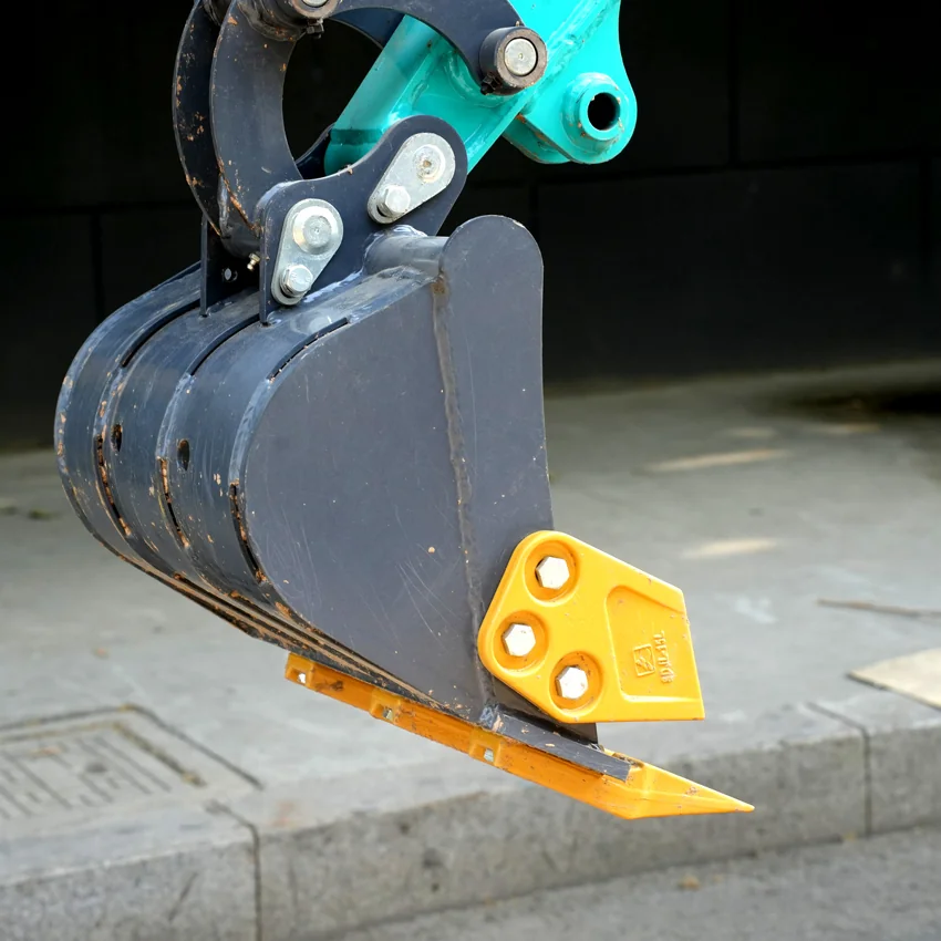 Vue latérale de la dent du seau